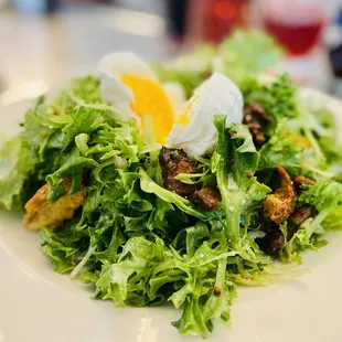 Frisée salad with a Warm Poached egg - perfection. Oui Oui.