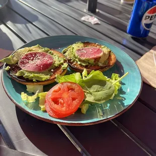Avocado toast on a bagel with watermelon radish