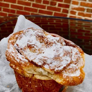 a pastry with powdered sugar on top