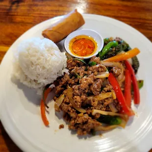 Lunch special: Spicy Thai Basil with pork; served with fried spring roll and rice.