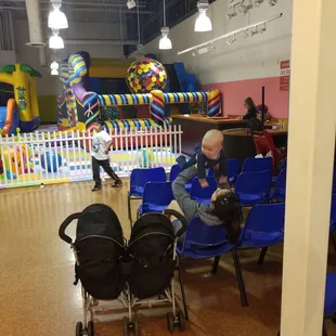 Area for parents to sit while watching kids play on bounce houses.