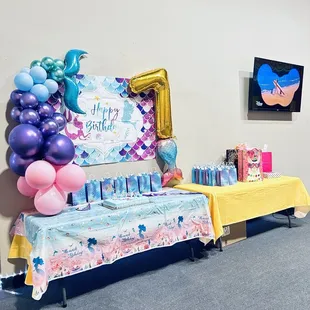 Clean and spacious party room for all your decor and includes cake, food, and gift tables. There's even a private bouncy house!