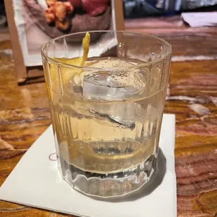 a glass of alcohol on a napkin