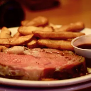 a plate of steak and french fries