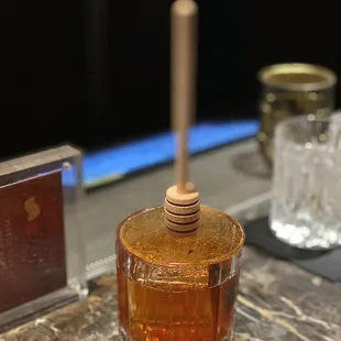 a bottle of bourbon with a wooden top