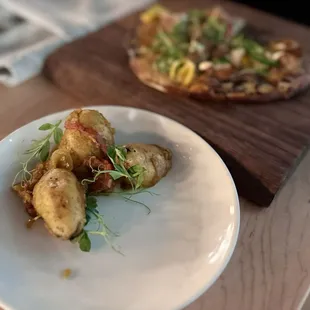 Curry fried potatoes and flatbread in background.