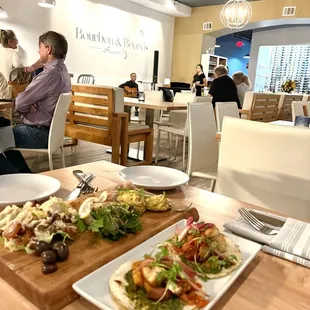 people sitting at tables in a restaurant