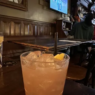 a drink in a glass on a table