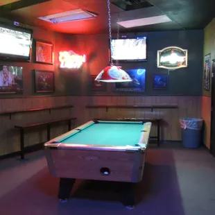 a pool table in a bar