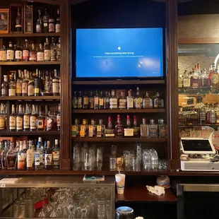 a bar with liquor bottles on shelves
