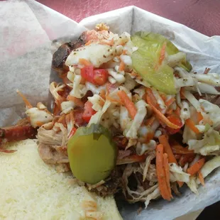 Pulled pork smothered in slaw and pickles