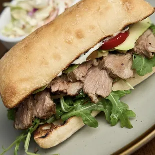 Steak Sandy - arugula, cherry pickled peppers, mayo, steak, avocado, pickled red onions. Best sandwich I've ever ate.