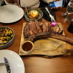 Tomahawk steak, Brussel sprouts and loaded potato with a nice bottle of wine.