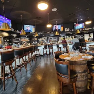 a view of the bar and televisions