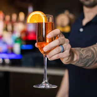 a man holding a glass of wine