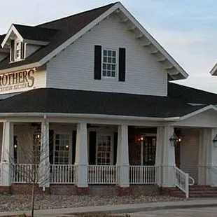 Bourbon Brothers Exterior. We've got a gorgeous wrap around porch to complete our restaurant with all the details of true Southern Charm!