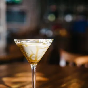 Every Monday is Martini Monday- where all signature martinies are just $5.00. Picture here is our Sour Apple Martini with caramel drizzle!