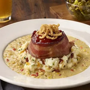 Smoked &amp; Bacon Wrapped Meatloaf atop loaded mashed potatoes, with creamed corn.