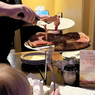 Getting our pizza served