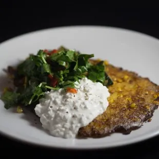 a plate of food on a black background