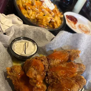 Loaded fries and breaded traditional garlic parm wings. Everything&apos;s good. But Ben made the 1st visit here remarkable. He&apos;s very attentive.