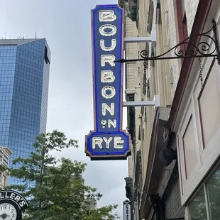 a neon sign for bourbon rye