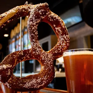 a pretzel and a glass of beer