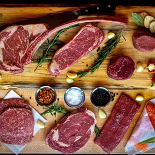 a variety of meats on a cutting board