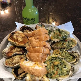 Chargrilled Oyster half with spinach dip and a bourbon grenade
