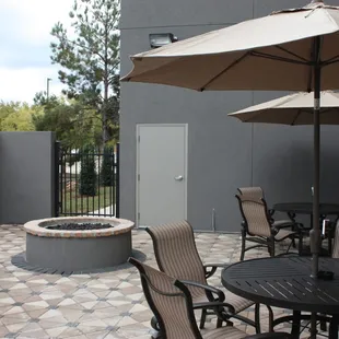 patio area with tables and umbrellas