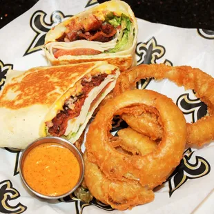 a sandwich and onion rings