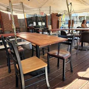 tables and chairs under a tent