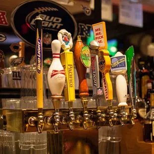 a row of beer taps