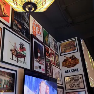 a variety of posters on the wall