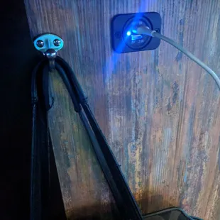Check it out each gaming machine is equipped with a purse hook underneath and a USB port to charge your phone!