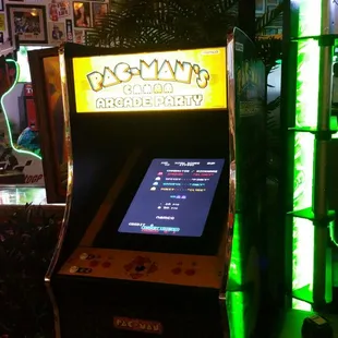 an arcade machine with neon lights