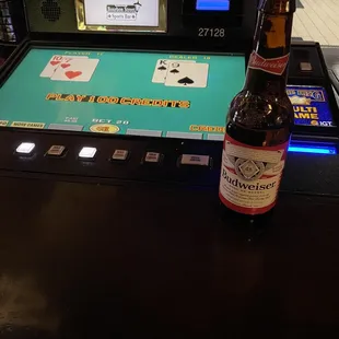 a bottle of beer on a casino table