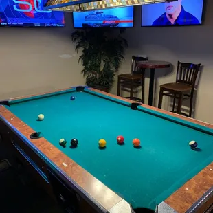 a pool table in a bar