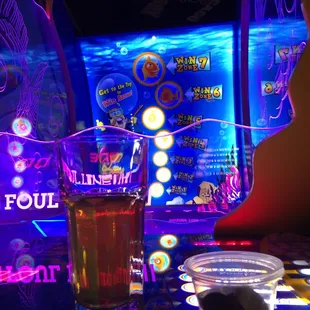 a glass of beer on a table