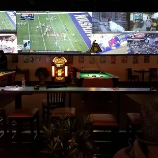 A whole wall of games and 2 pool tables