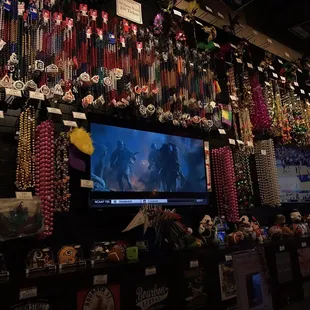 a wall full of beads and necklaces