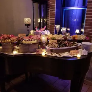 Grand piano with all of the non passed apps on top! Such a pretty display!