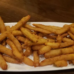 Fried pickles with white BBQ sauce