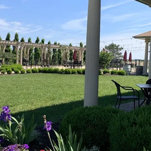 a patio with tables and chairs