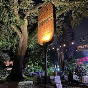 a wooden sign for a cafe