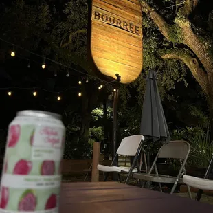a can of beer sitting on a table