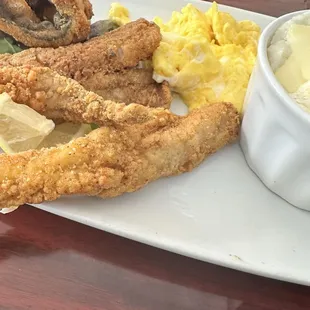 Fish, cheese grits, and eggs.