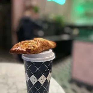 a cup of coffee and a pastry