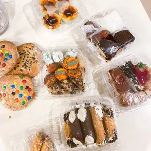 Creme Brulee, cookies, cannoli, Boston Cream Cake, Coconut Cake, Tiramisu Cake, Lobster Tail, Chocolate Dipped Strawberries