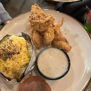 Chicken tenders, loaded, baked potato, white gravy, asparagus